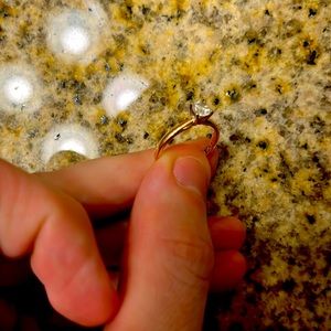 14k rose gold engagement ring with a 1/2 carat diamond